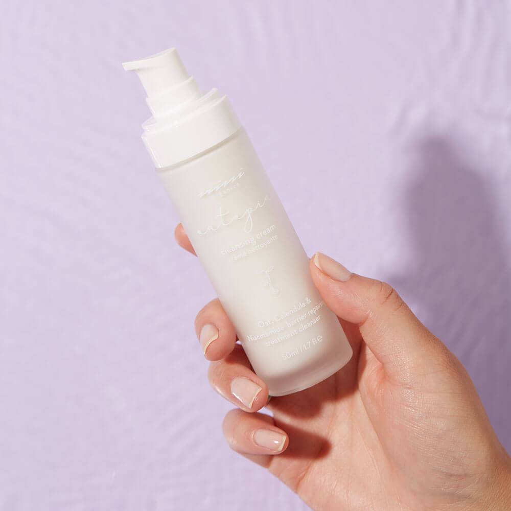 Women Holding Oatopia Cleansing Cream